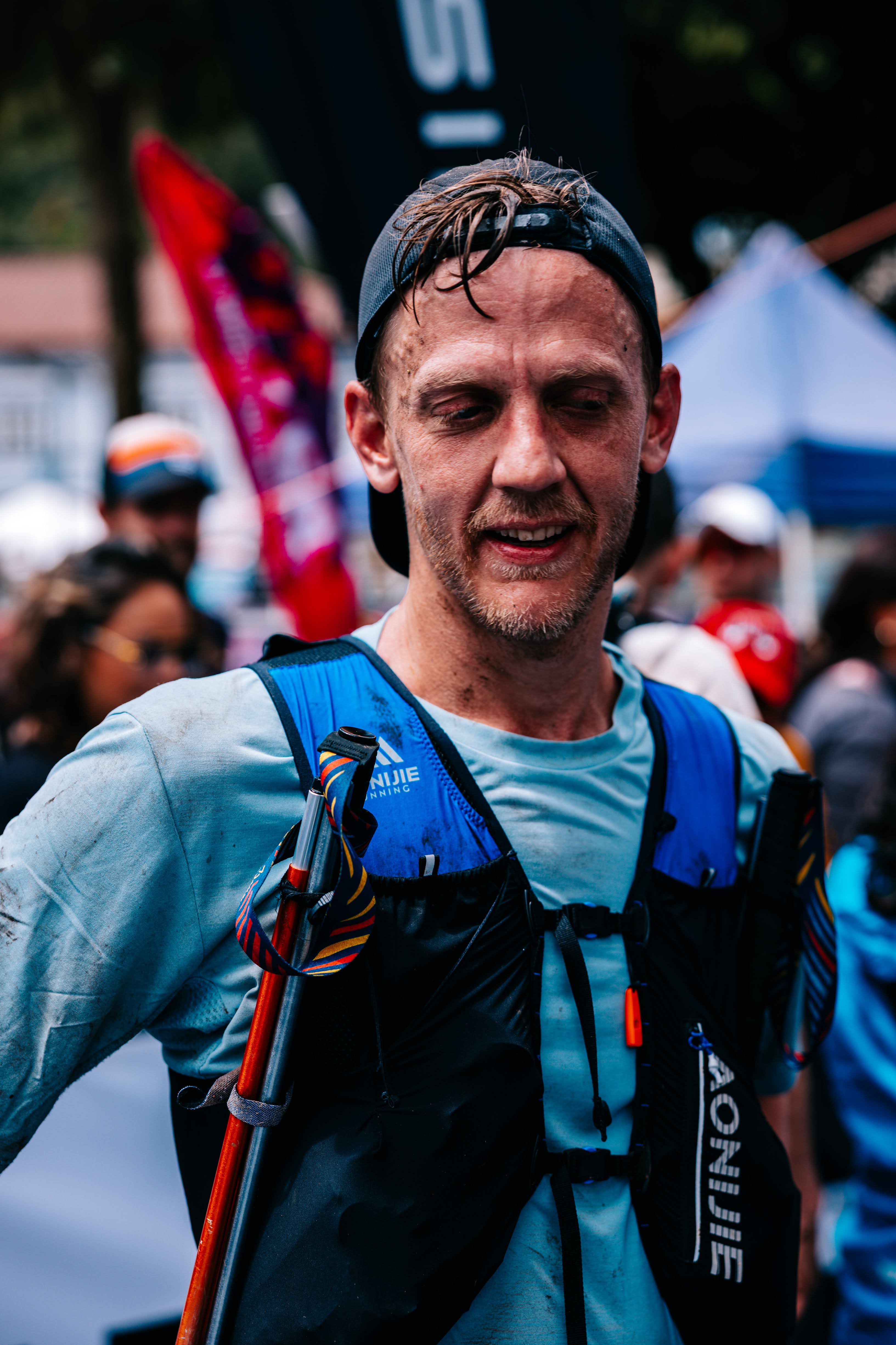 Travis wearing a hydration vest after a trail race in Ecuador