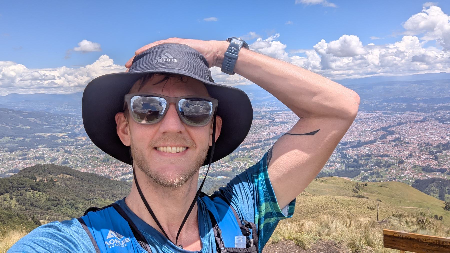 Travis Pence with Ecuador mountains behind him